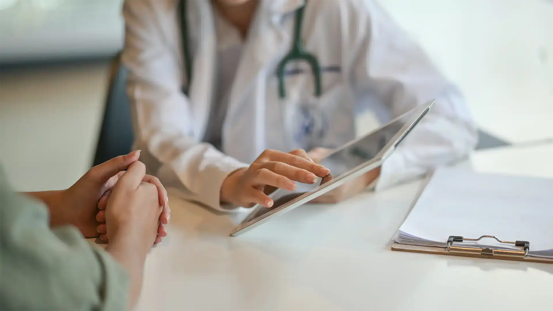 Doctor discussing with patient the results of an HPV screening test in Singapore.